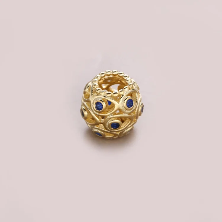 Obesek PANDORA Ocean Treasures, temno modri topaz 14K zlato - 750817TPP