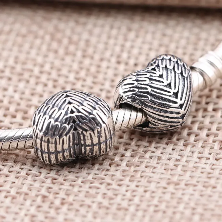 PANDORA Obesek z angelskim perjem - 791751